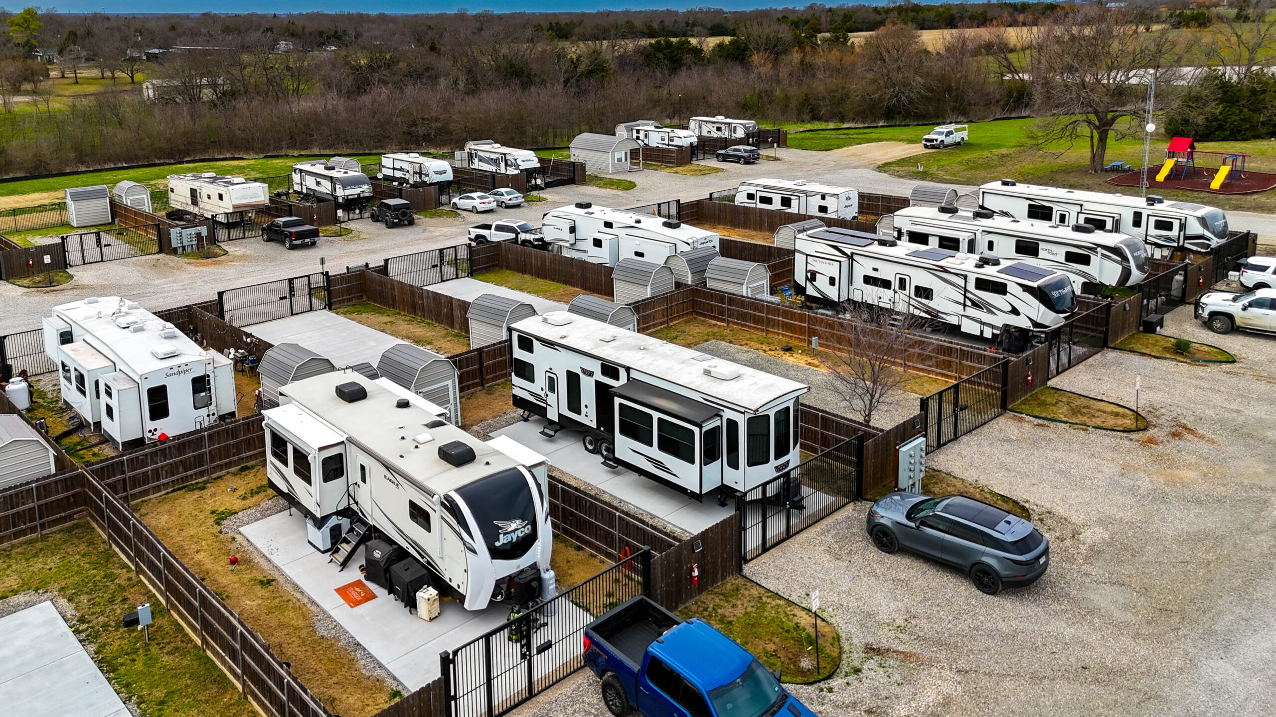 Aerial layout of spacious concrete RV pads and wide gravel roads at Desert Creek RV Estate
